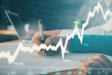 Double exposure of forex chart drawing over people taking notes background. Concept of financial analysis