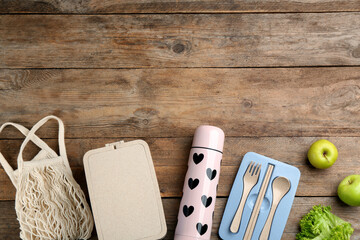 Wall Mural - Flat lay composition with thermos on wooden table. Space for text