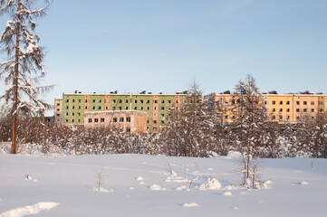 Wall Mural - Abandoned apartment buildings in the ghost town Kadykchan, famous for coal mines, Kolyma, Magadan region, during sunny winter day