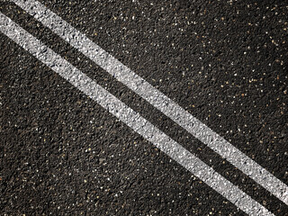 Wall Mural - Double white lines on asphalt road background.