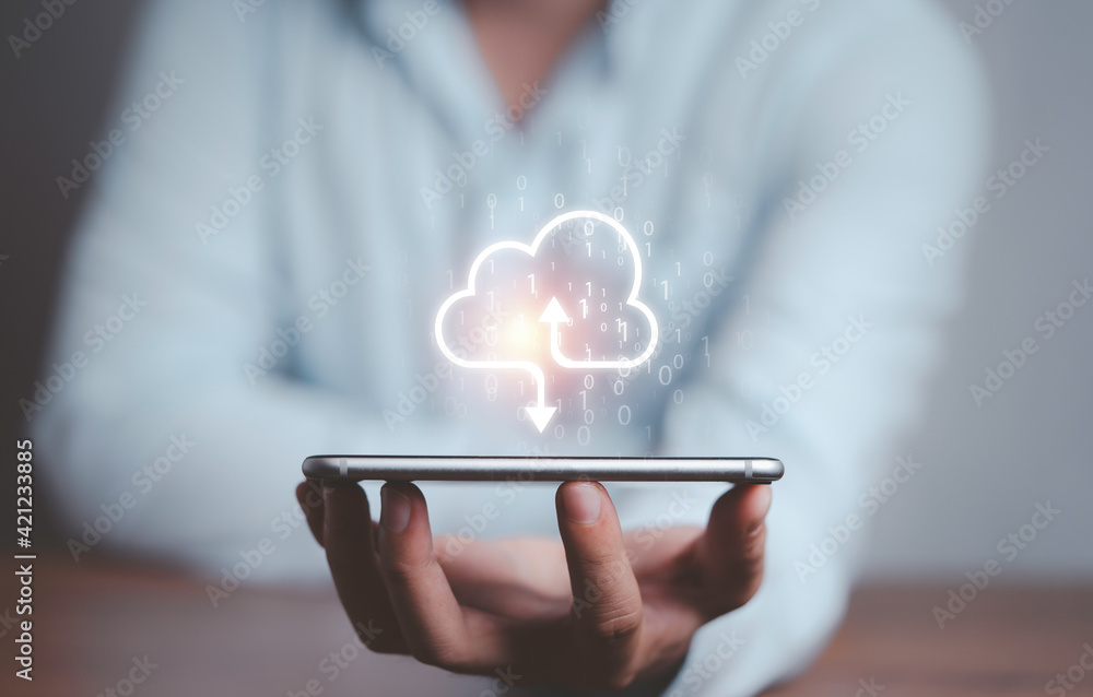 Businessman holding virtual cloud computing on smartphone to transfer data information and upload download application. Technology transformation concept. - obrazy, fototapety, plakaty 