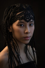 Wall Mural - Young asian woman with ethnic braids