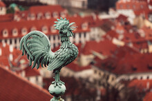Bronze Weathercock In Prague City