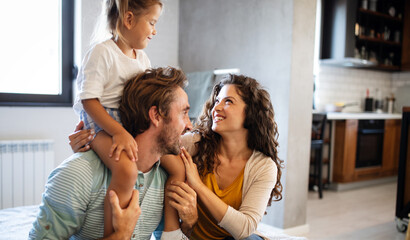 Wall Mural - Happy family having fun times at home