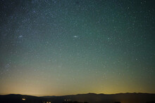 Night Sky Over Mountains With Galaxy Of Andromeda In The Center Of The Picture