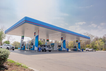 Gas fuel station with clouds sky and sun light