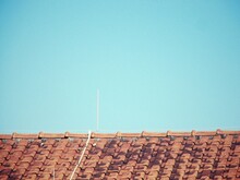 Low Angle View Of Roof Against Blue Sky
