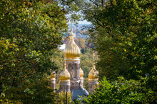 The Golden Domes Of The Russian Orthodox Church Of St. Elizabeth In The German City Of Wiesbaden