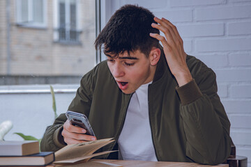 Sticker - student looking surprised at the mobile phone