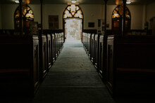 Alley Amidst Benches In Church