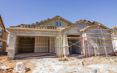 New Stucco On One Level Home With Metal Scaffolding