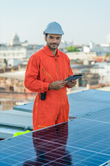 alternative energy engineer checking energy power performace of solar power system