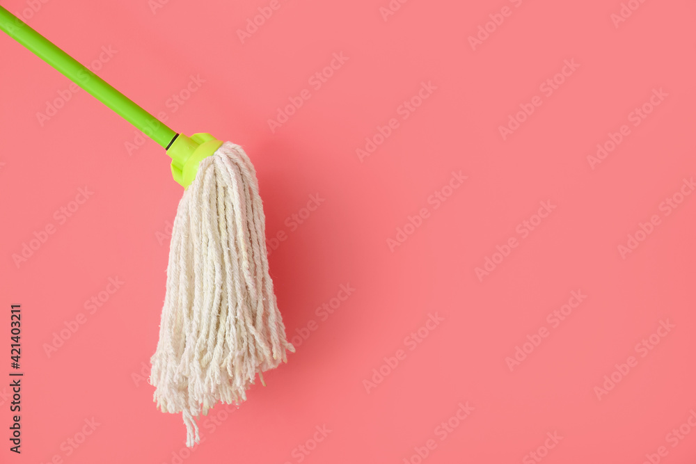 Floor mop on color background