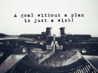 Wall Mural - Inspirational and Motivational Concept - 'A goal without a plan is just a wish' with vintage background. Stock photo.