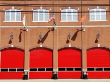 Red Doors On Wall Of Fire Department Building