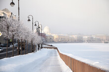 Beautiful Winter Cityscape Of Saint Petersburg With Frosty Trees And White Snow Sidewalk Near Frozen Neva River