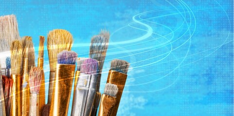 Wall Mural - Row of artist paint brushes on colored background