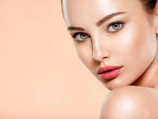 Wall Mural - beautiful face of young woman with health fresh skin. portrait of beautiful brunette woman with clea