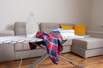 Wall Mural - Modern new electric iron on iron board with shirts