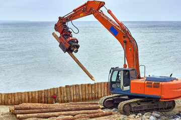 Construction of wooden breakwaters from larch trunks