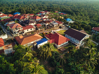 Aerial shot of colorful buildings surrounded by trees