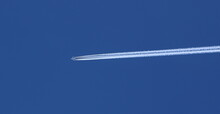 Airplane Flying Against Clear Blue Sky