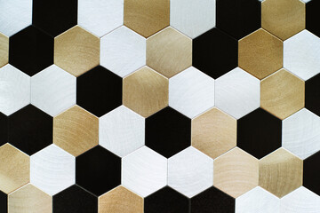 Metal tile for wall cladding in the form of honeycombs. Decoration material made of small hexagonal elements. Flat lay of the frame