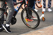 © Dmitry - Young people ride bicycles and scooters along the city streets. A hangout of teenagers leading an active lifestyle. Cropped frame. Beyond recognition