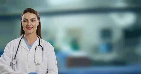 Sticker - Portrait of caucasian female doctor with arms crossed smiling against hospital in background