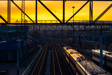 High Angle View Of Train At Railroad Station During Sunset