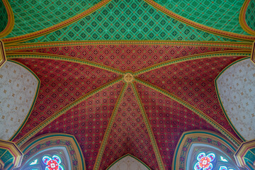 Catholic chapel ceiling in red and green polychrome gothic style with golden designs. Nova Friburgo City, Rio de Janeiro, Brazil. 02-15-2021