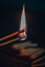Close-up Of Burning Candle Against Black Background