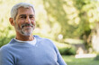 © PhotoAlto - Portrait of smiling mature man in backyard