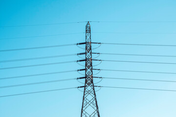 Wall Mural - High voltage electricity pole on bright sky clouds background, electricity transmission pylon, Power distribution