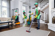 © sofiko14 - Group of four multiracial people cleaning client house