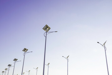 Wall Mural - solar cell lamp electricity system for alternative power energy on street with green tree nature, fu