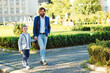 © volurol - Handsome father and kid wearing stylish suits. Family, fashion and lifestyle.