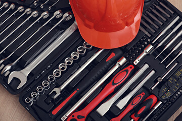 Toolbox, tools kit detail and orange protective helmet close up. instruments. set of tools. car tool kit. tool set background. instruments for repair.