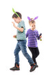 © sharplaninac - Playful kids with Easter bunny hats listening music dancing in circle and chasing each other. Full body isolated on white background