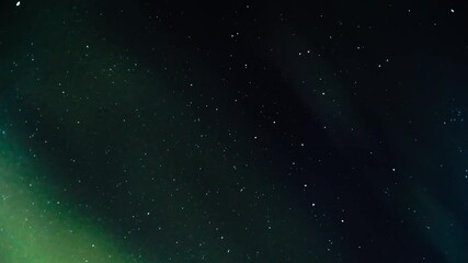 Wall Mural - green and violet northern lights including clouds