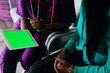 © Gerald R Carter Jr/Creative Flame - Black nurse reviewing information digitally on tablet with patient at medical facility