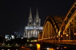 Cologne Cathedral and Hohenzollern Bridge at sunset / nighttime