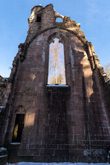 Canvas Print - Low angle shot of ruins All Saints' Abbey on the blue sky background, in the Black Forest, Germany