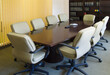 © Tetra Images/Tetra Images - Desk and chairs in conference room