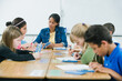 © Erik Isakson/Tetra Images - Students doing math work in classroom