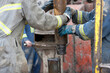 © Dan Bannister/Tetra Images - Oil workers drilling for oil on rig