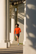 © Noah Clayton/Tetra Images - USA, California, Oakland, Young woman jogging