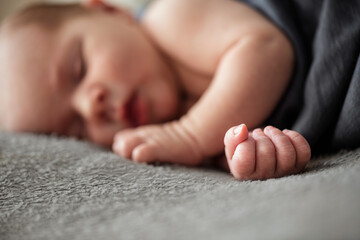 Wall Mural - Close up of newborn baby hand