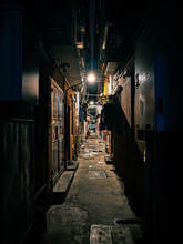 Vertical Shot Of Dark City Alley At Night