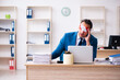 © Elnur - Blindfolded male employee working in the office